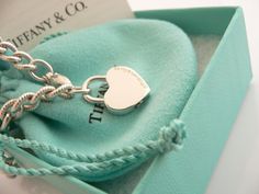 Offered for sale is a wonderful and rare Tiffany and Co. Sterling Silver "I Love You" Heart Padlock bracelet. The piece is made from substantial and bright Tiffany silver, and yet retains a very feminine feel to it. Attached to its very substantial Tiffany Silver Textured charm bracelet is a Heart padlock charm with "I Love You" written in beautiful script. The "I Love You" heart padlock charm opens and closes and thus can be used as a charm on a necklace or as part of another charm bracelet! Su Padlock Bracelet, Heart Padlocks, Tiffany And Co, Tiffany Heart, Heart Charm Bracelet, Tiffany & Co., A Heart, I Love You, Charm Bracelet