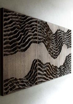 two wooden panels with wavy designs on them