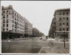 an old black and white photo of a city street