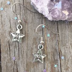 "Cute Star Earrings with Smile Face Star face charm about 1/2\". Star is zinc alloy. Surgical steel ear wires. Your earrings will come in an organza bag to gift or keep for yourself. Bubble wrapped for safe travel. Flat rate shipping no matter how much your order. To view a personalized sun necklace click here: https://www.etsy.com/listing/292929419/sun-initial-birthstone-choker-custom-sun?ref=shop_home_active_3 To view other earrings: https://www.etsy.com/shop/Beadaboutique?ref=ss_profile§ion_i Symbolic Star-shaped Nickel-free Earrings, Symbolic Nickel-free Star Earrings, Nickel-free Star Shaped Symbolic Earrings, Symbolic Star Shaped Earrings For Gift, Moon Charm Star Earrings As Gift, Moon Charm Star Earrings For Gift, Moon Charm Star-shaped Earrings For Gifts, Star-shaped Moon Charm Earrings For Gift, Moon Face Earrings