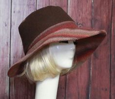 Wide Brim Sun Hat -Brown Wool with burgundy contrast print Inside black cotton band, the hat has a 2 section crown 3 1/2 " in length and a one piece 4" brim, and is lined in a cotton blend print. This hat is one size fits all and will fit 21" - 23" head size. Brown Sun Hat With Short Brim, One Size, Retro Brown Wide Brim Fedora, Fitted Hat With Short Brim And Lining, Brown Flat Brim Bucket Hat For Winter, Retro Brown Hat With Curved Brim, Brown Wide Brim Fitted Hat, Brown Bucket Hat For Fall, Brimmed Brown Hats, One Size, Brown Brimmed Fedora One Size