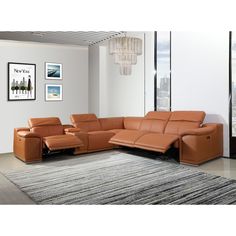 a living room with a sectional couch and rug