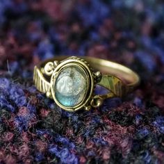 Pretty labradorite ring in gold colour made of brass. Available in a variety of sizes. We also have this design available with different gemstones: Moonstone or Turquoise. Please see our shop for details.We have a lovely selection of jewellery, utility belts and clothing. Please see our shop for more products.For a size chart please go to www.ringsizes.co or send us a message if you have any questions about sizing. These are also available for wholesale.Do not hesitate to contact us if you have Labradorite Ring, Stacked Jewelry, Wedding Rings Unique, Bohemian Chic, Boho Rings, Bohemian Jewelry, Ring Gift, Unique Rings, Handmade Ring