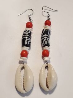 Check out this item in my Etsy shop https://www.etsy.com/listing/1022248552/black-white-ghana-krobo-cowrie-shell Black Beach Jewelry With Dangling Beads, Beach Jewelry With Black Dangling Beads, Black Dangling Beads Jewelry For Beach, Gift White Beaded Earrings With Black Beads, White Bohemian Beaded Earrings With Black Beads, Bohemian White Earrings With Black Beads, White Dangle Jewelry With Black Beads, Black Beaded Earrings For Beach, Black Beaded Earrings For The Beach