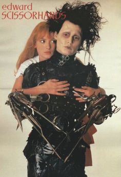 two people dressed in costumes with scissors and hair on their heads, one holding the other's arm