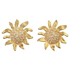 Vintage Gold Tone and Diamante Sun Flower Earrings, Circa 1980's. These are well made and substantial earrings The earrings have a dome of the diamante in the center. All the petals are free form and going various directions to create the perfect flower. These are the perfect 1980's earrings. Quite special and unusual. Clip on. Sun Earrings, Flower Earrings, Clip On, Vintage Gold, Clip On Earrings, Gold Tones, Jewelry Earrings, Sun, For Sale