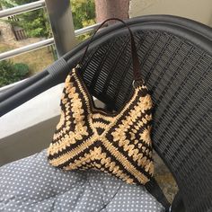 Welcome to our shop! 🌟 This handmade granny square bag with a brown leather strap is the perfect accessory to complement your style. Each granny square motif features a unique pattern, making this bag truly one-of-a-kind. The durable leather strap provides sturdy construction for long-lasting use, while the spacious interior allows you to comfortably carry your daily essentials. 👜 Carry elegance and craftsmanship with every step with this bag. It's also a perfect choice as a special gift for l Square Beige Beach Bag, Hand Knitted Rectangular Bag For Everyday, Beige Rectangular Crochet Bag With Granny Square, Rectangular Crochet Bag In Beige With Granny Square, Rectangular Beige Crochet Bag With Granny Square, Brown Square Straw Bag, Handmade Square Straw Bag, Handmade Square Hobo Bag For Vacation, Hand Knitted Square Shoulder Bag