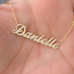 This unique personalized script font nameplate cut-out necklace is composed of 14K solid gold and beautifully pavé set with genuine GVs1 quality natural real Diamonds. This pendant is complemented by a durable 14K solid gold adjustable chain or can be purchased as a charm alone without the chain under the "Length" drop-down menu. NOTE: The item will be made in the exact casing of the characters entered. Please be mindful of this detail when providing the customization desired. Name Dimensions: a Elegant Named Cubic Zirconia Jewelry, Anniversary Cubic Zirconia Nameplate Jewelry, Personalized Gold Cubic Zirconia Jewelry, Elegant Yellow Gold Name Necklace With Diamond Accents, Gold Cubic Zirconia Jewelry For Personalized Gifts, Personalized White Gold Jewelry With Diamond Accents, Personalized White Gold Diamond Jewelry, Elegant Customizable Gold Plated Necklaces, Elegant Customizable Gold Plated Jewelry