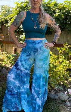 Made from 100% woven Rayon Light, these tiered pants have bohemian flare!   Comfortable and easy to wear with elastic waistband and two gathered tiers in the pant legs.  US Women's size small. measurements: waist: 14-21"(stretched) inseam: 32" rise: 14" hip: 23" Summer Rayon Tiered Skirt, Summer Tiered Rayon Skirt, Summer Tiered Skirt In Rayon, Flowy Tiered Beach Bottoms, Flowy Tiered Bottoms For Beach, Rayon Tiered Skirt For Beach, Rayon Tiered Skirt For The Beach, Flowy Tiered Skirt For Vacation, Beach Rayon Tiered Skirt