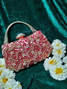 ❤︎ This Indian art hand embroidery  bag looks nice & convenient to carry with both ethnic & western wear. It is superb for weddings and festive parties. This potli bag is the perfect Christmas handmade gift idea. Gifting idea for giving to any girl & woman on any special occasion. ❤︎ Designed with the heart. This potli clutch or Indian batawa bag is made of premium and superior quality. It is attractive and eye catchy. ❤︎ It is a combination of both modern and traditional embroidery work. This silver potli bag is enough to keep your all essential accessories. Mobile phones can also be placed easily and safely. ❤︎ More variety and different types and more colorful handbags are available in our shop. Have a look. You have found us we will bring colors to your home. ⦿ Material : heavy beads a Bollywood Style Shoulder Bag With Zari Work, Festive Multicolor Shoulder Bag With Dori Work, Elegant Pink Shoulder Bag For Festive Occasions, Handwork Shoulder Bag For Diwali, Festive Red Shoulder Bag With Handwork, Multicolor Shoulder Bag With Zari Work For Festive, Festive Multicolor Shoulder Bag With Zari Work, Elegant Festive Bags With Mirror Work, Festive Potli Bag With Mirror Work