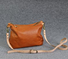 "Medium leather crossbody bag, Camel clutch purse, Leather every day purse, Every day bag, Brown- small leather cross body bag -Gift for women This small perfect size leather crossbody bag has two inner pockets, one which zips closed and one slip pocet for your phone. The satchel is made from soft italian distressed leather, lined with cotton lining for secure. It's designed it to be classy and minimal to match with any outfit. * Made from genuine Italian leather. * Adjustable crossbody strap. * Soft Leather Crossbody Clutch For Everyday, Everyday Soft Leather Crossbody Clutch, Leather Shoulder Bag Clutch As Gift, Leather Crossbody Clutch For Daily Use, Leather Clutch Shoulder Bag For Gift, Everyday Textured Leather Clutch Shoulder Bag, Brown Crossbody Clutch For Gift, Brown Crossbody Clutch As Gift, Everyday Textured Leather Crossbody Saddle Bag