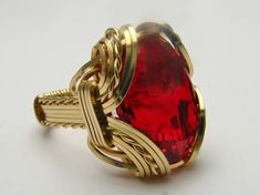 Wire wrapped Ring Statement Ring Handmade 14kt Gold Filled Wire Wrap Man Made Red Ruby Gemstone Ring 18x13mm (3/4x1/2 inch) 10+ct Sizing and shipping is ALWAYS FREE Take a look at our quality, workmanship, free shipping, no questions asked return policy, lifetime warranty, free sizing and cleaning for life for life. All these are explained in the description below or feel free to reach out to us. *In the notes section of your order, please specify ring size.* This ring is made with real gems. I Wire Wrapped Ring, Family Jewellery, Wire Wrapped Rings, Ruby Gemstone, Red Ruby, Gold Wire, Wrap Rings, Ring Handmade, Wire Wrap