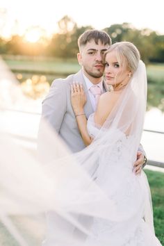 a bride and groom pose for a wedding photo