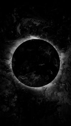 the eclipse in black and white is seen from space, with only one light visible