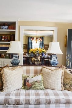 a living room filled with furniture and lamps