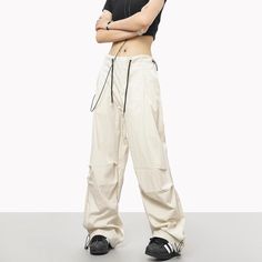 5ft 4''(163cm) tall, 97 lbs(44kg) weight and wearing a size M - Wide straight fit- Adjustable ankle- Adjustable waist- Drawstring- 6 colors Baggy Straight Leg Sports Pants, Spring Wide Leg Cargo Sports Pants, Spring Wide Leg Cargo Pants For Sports, Sports Wide Leg Pants With Cargo Pockets, Urban Style Straight Leg Sports Pants, Urban Straight Leg Sports Pants, Sports Bottoms With Cargo Pockets And Wide Leg, Relaxed Fit Straight Leg Cargo Pants For Sports, Wide Leg Sports Bottoms With Cargo Pockets