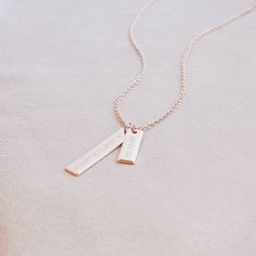 With wedding season in full swing, this is the perfect gift for the bride. Get the date and location of their wedding for a forever memory. #bridalgift #coordinatenecklace #jewelry Gold Rectangular Pendant Necklace For Keepsake, Elegant Engraved Charm Necklaces With Rectangular Pendant, Elegant Engraved Charm Necklace With Rectangular Pendant, Rose Gold Nameplate Charm Necklace For Anniversary, Elegant Personalized Charm Necklace With Rectangular Pendant, Rose Gold Sterling Silver Charm Necklace For Anniversary, Rose Gold Sterling Silver Rectangular Pendant Jewelry, Rose Gold Sterling Silver Jewelry With Rectangular Pendant, Elegant Charm Necklaces For Mother's Day Keepsake