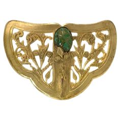 This is an Art Nouveau style gilt brooch with one piece of green art glass. The "C" clasp indicates that it dates from the early 20th century. With an organic shape and beautiful botanical pattern, we can spot some bronze underneath the gilt, but over all it still could be considered in pretty good condition, especially for it's age. Our vintage jewelry collection and original creations are all unique listings. We never have multiple copies of anything. So, if you miss the current opportunity yo Luxury Art Nouveau Filigree Brooches, Luxury Art Nouveau Hallmarked Brooch, Luxury Gold Art Nouveau Brooches, Luxury Collectible Art Nouveau Brooch, Luxury Art Nouveau Wedding Brooches, Stile Art, Brooch Art, Art Nouveau Style, Botanical Pattern