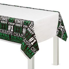 a table with a green and black tie on it