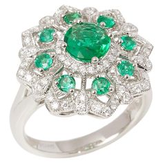 This ring designed by David Jerome is from his private collection and features one round cut Emerald totalling 1.32cts sourced in the chivor mine Columbia. Set with round brilliant cut Diamonds totalling 0.35cts mounted in a platinum setting. Finger size UK M 1/2, EU size 53 1/2, USA size 6 1/2. David prides himself in only sourcing the finest and most exclusive gemstones whose natural beauty and colour enhance the settings he creates for each piece. These exclusive designs offer buyers a unique opportunity to own the kind of jewellery usually reserved for the finest and most exclusive brands in the world. A real legacy for the future. Argentium Silver Jewelry, Round Cut Ring, White Sapphire Ring, Platinum Diamond Rings, Argentium Silver, Platinum Ring, Gorgeous Jewelry, Emerald Diamond, White Sapphire