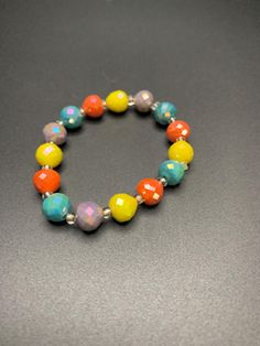 Multi colored beaded bracelet Colorful Faceted Beads Bracelets As Gift, Faceted Beads Stretch Bracelet, Rainbow Beaded Bracelets With Faceted Beads For Gift, Rainbow Faceted Round Beads Bracelets, Trendy Multicolor 8mm Beaded Jewelry, Rainbow Faceted Beads Bracelet As Gift, Multicolor Bangle Bracelet With Spacer Beads, Trendy Multicolor Stretch Bracelet With Faceted Beads, Adjustable Multicolor Faceted Beads Bracelets