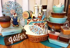 a table topped with lots of different types of dishes and bowls on top of each other