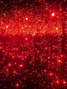 red lights shine brightly on the surface of a room with no one in it,