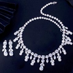 A luxurious two-piece bridal jewelry that will add elegance and sophistication to any wedding gown or formal ensemble! Adorned with intricately faceted cubic zirconia that capture the light from every angle with a perfectly translucent appeal, the pieces are platinum plated for a flawless finish which enhances the intricate detailing and conveys a modern take on old elegance. Necklace: 42cm (approx. 16.5") long with a secure fold-over closure (a 2" extension chain can be added upon request, plea Silver Wedding Jewelry, Bridal Jewelry Set, Bridal Jewelry Sets, Wedding Gown, Jewelry Set, Bridal Jewelry, Wedding Jewelry, Wedding Gowns, Diamond Necklace