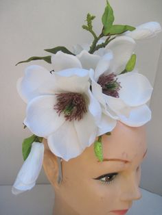 * This Magnolia headpiece has been designed on a high polish silver metal headband that is comfortable and will fit any head size. * The design has open Magnolia flowers along with buds and opening blossoms. * It can be worn all year round and for varied occasions. * All of the design is secure, evenly balance and comfortable to wear and will fit any head size. * Great to wear to Diner en Blanc, weddings, various showers, birthday celebrations, tea parties, dinner engagements, Horse Race Events, Whimsical Adjustable Flower Headpieces, Adjustable Pinched Crown Headpiece For Garden Party, Flower Headpieces For Kentucky Derby, Handmade Flower Headpieces For Garden Party, Adjustable Flower Headband For Garden Party, Adjustable Floral Headband For Garden Party, Adjustable Headpieces With Matching Headband For Garden Party, White Headband For Garden Party, Kentucky Derby Flower Headband With Handmade Flowers