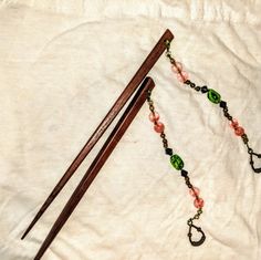 Chinese Wood Hair Chopsticks W/Ornate Beads, Brown Wood Sticks And Metal Loop At The Bottom For Gentle Weight. Never Worn. Bought From A Chinese Performer Who Made Their Own Costumes. Beaded Hair Sticks, Chinese Hair Chopsticks, Chinese Hair Sticks Style, Japanese Hair Pins Sticks, Hair Chopsticks, Beaded Hair Combs, Chinese Hair Pins Sticks, Hair Donut, Chop Sticks