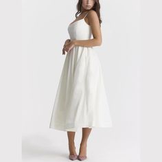 Step into elegance with our Spaghetti Strap A-Line fit and flare Midi Dress. This dress promises a graceful silhouette with its fitted bodice and flowing skirt. The spaghetti straps offer a delicate touch, perfect for both casual outings and special occasions. Made from lightweight, breathable fabric, it's designed for comfort without sacrificing style. Pair it with sandals for a relaxed look or heels to make a statement. Versatile and chic, this midi dress is a wardrobe must-have. Color: White, Brunch Dress With Fitted Bodice And Spaghetti Straps, Fitted Bodice Dress With Spaghetti Straps For Brunch, Spaghetti Strap Dress With Fitted Bodice For Brunch, Brunch Dress With Spaghetti Straps And Fitted Bodice, Summer A-line Suspender Dress With Fitted Bodice, Fitted Bodice Sundress With Spaghetti Straps For Brunch, Sundress With Fitted Bodice And Spaghetti Straps For Brunch, A-line Midi Dress With Adjustable Straps And Fitted Bodice, Sundress With Spaghetti Straps And Fitted Bodice For Brunch