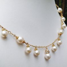 This romantic white pearl necklace is handmade with perfectly polished natural freshwater pearls and just enough sparkly Swarovski crystal accents. Expertly hand wire wrapped with 14k gold filled wire, chain and clasp. A gorgeous statement necklace for a blushing bride on her wedding day. A thoughtful gift for a woman born in June since her birthstone is the precious pearl.Necklace Details:- Necklace Length is 18 inches (43.18 cm) plus a 1 inch extender for the perfect fit- The central pendant l Pearl Wire Wrapped Necklace For Wedding, Wire Wrapped Pearl Necklace For Wedding, Wedding Pearl Necklace With Wire Wrap, Pearl White Akoya Pearl Bridal Necklace, Exquisite Pearl Necklace For Anniversary, Exquisite Pearl Necklace For Wedding, Beaded Akoya Pearl Wedding Jewelry, Gold Wire Wrapped Pearl Necklace For Wedding, Elegant Pearl Wire Wrapped Necklaces