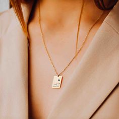 ELEGANT ENGRAVED RECTANGLE NECKLACE Latest trend and add to our contemporary collection this elegant engraved rectangle necklace. A sophisticated, delicate profile holds a unique meaning: up to four names engraved with a heart. An extraordinary gift to treat somebody you love. CHARACTER LIMIT Max 10 letters per name ITEM SPECIFICATIONS • Finish: 18K Gold ∙ 925 Sterling Silver ∙ Rose Gold• Dimensions: Adjustable Length Chain 15” | Pendant 12x18mm Unique Meaning, Rectangle Necklace, Mom Jewelry, Latest Trend, Necklace Personalized, Coin Necklace, Minimalist Necklace, Personalized Necklace, Silver Rose Gold