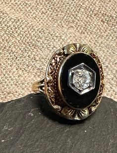 "10K antique Edwardian ring old European cut Dia(approx. 1/4 Carat), black onyx.  Size 4 3/4, wt.-  3.4 grams, top of ring approx. 3/4\" by 1/2\".  Condition very good for its age, any slight wear commensurate with age-photos show details.  Elegant black and white, onyx raised bezel set, white antique diamond set in white gold the ring is yellow gold, Combination of flattering oval shape, filigree added leaf decoration make for an intriguing design." European Cut Diamond Ring, Leaf Decoration, Edwardian Ring, Age Photos, Gold Diamond Engagement Rings, White Onyx, White Gold Sapphire, Sapphire Diamond Ring, Leaf Decor