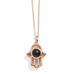 Introducing our Personalized Hamsa Necklace, a unique accessory that blends tradition with personal storytelling. This necklace features a Hamsa pendant, a symbol of protection and good fortune, designed to hold a special photo inside. It's not just a piece of jewelry; it's a personal talisman that keeps your cherished memories close to your heart. Perfect for everyday wear or as a meaningful gift, this necklace adds a personal touch and a layer of significance to your style, ensuring that what' Engraved Amulet Jewelry For Good Luck, Good Luck Spiritual Necklace With Round Shape, Blessing Medallion Charms Jewelry, Spiritual Good Luck Necklace With Round Shape, Spiritual Round Good Luck Necklaces, Spiritual Good Luck Round Necklace, Spiritual Rose Gold Locket Necklace, Spiritual Medallion Pendant Necklace With Charms, Amulet Style Jewelry With Large Pendant For Blessing