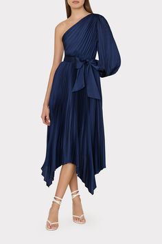 Meet the ultimate Fall party dress. Rendered from a luxe satin fabric, the Essi is crafted with a one-shoulder silhouette with a voluminous bell sleeve, leaving the other arm completely bare. It’s pleated throughout with a tie waist for added definition and flowy maxi skirt with a handkerchief hemline. It comes in a neutral navy or bright pink. Fall Party Dress, Flowy Maxi Skirts, Maxi Dress Cocktail, Denim Coat Jacket, Denim Coat, Sweater And Shorts, Pink Dress, Knit Dress, One Shoulder Dress