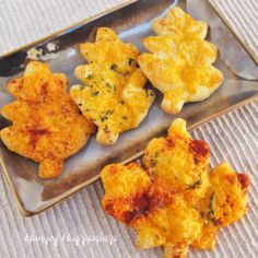 some fried food is on a metal tray