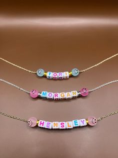 This necklace is the perfect personalized gift for all kids! Adjustable Round Bead Necklaces For Mother's Day, Cute Personalized Multicolor Charm Necklaces, Trendy Personalized Necklace For Birthday, Trendy Customizable Necklace For Personalized Gifts, Trendy Customizable Necklaces For Personalized Gifts, Customizable Trendy Necklaces For Personalized Gifts, Trendy Personalized Jewelry For Birthday, Customized Multicolor Cute Jewelry, Customized Cute Multicolor Jewelry