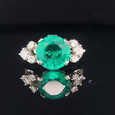 GORGEOUS Vintage 14K WHITE GOLD gem green  lab  grown emerald in round  shape,center weight 3.05ct. size 10mm very nice rich vivid green color  nice luster, very lively ,nice cut.clean emerald.brilliant ,sparkly emerald.  side six diamonds total weight 0.45ct. G-SI1  ring size 5 Resizable  Appraisal available  Retail value $5,500 net . Vintage Green Emerald Ring Gia Certified, Vintage Emerald Ring With Vvs Clarity, Vintage Green Emerald Ring With Brilliant Cut, Gia Certified Green Diamond Ring In Vintage Style, Classic Round Emerald Diamond Ring, Timeless Green Diamond Round Ring, Green Diamond Ring With Brilliant Round Cut, Green Diamond Ring With Brilliant Cut, Green Diamond Ring With Vvs Clarity Round Cut