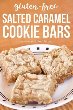 three pieces of baked caramel cookie bars on a white and black plate with the words gluten - free salted caramel cookie bars