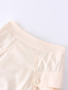 The Button Cargo Pocket Skirt in Ivory offers both style and functionality. Its neutral color makes it easy to pair with any outfit. A must-have addition to your wardrobe. Cream Mini Skirt For Work, Cream Lined Mini Skirt For Work, Chic Beige Skirt With Button Closure, Chic Beige Mini Skirt With Pockets, Beige Mini Skirt With Button Closure, Chic Cream Lined Skirt Bottoms, Cream Lined Skirt Bottoms For Work, Cream Lined Skirt For Workwear, Cream Lined Skirt For Work