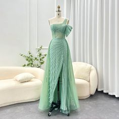 This one-shoulder evening dress radiates luxury and elegance with its sage green color and exquisite design. Perfect for weddings, formal events, and parties, this dress combines style and sophistication. Look and feel like royalty in the beautiful and unique luxury Dubai dress. window.adminAccountId=244214477; Green Evening Dress For Banquet During Prom Season, Green One-shoulder Wedding Gown, Green One-shoulder Evening Dress For Wedding, Green Off-shoulder Gown For Wedding, Elegant Green Prom Gown, Green Evening Dress With Fitted Bodice For Prom, Green Strapless Evening Dress For Banquet, One Shoulder Evening Dress For Gala Banquet, Green Evening Dress With Sweep Train For Banquet