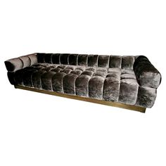 an image of a couch that is made out of velvet