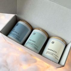 three cans of namaste are sitting in a box