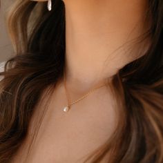 Featuring a delicate pearl and classic gold chain, this timeless piece adds a bit of romantic charm to your look. It's the perfect necklace to make your day just a little more special! DETAILS14k gold fill or sterling silver14", 16", or 18" lengths with a 1" clasp extender chain, Gemstone measures at 0.25"Hypoallergenic and waterproof Delicate Pearl Chain Charm Necklace For Everyday, Everyday Delicate Pearl Chain Charm Necklace, Dainty Pearl Pendant Chain Necklace For Wedding, Classic Gold Charm Necklace With Pearl Drop, Dainty Pearl Charm Necklace For Everyday, Classic Pearl Pendant Charm Necklace As Gift, Classic Pearl Pendant Charm Necklace For Gift, Classic Gold Pearl Chain Charm Necklaces, Classic Gold Charm Necklace With Pearl Chain