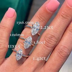 three different sizes of engagement rings on someone's hand with measurements for each ring