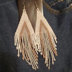 These handmade, bohemian vintage braided beaded tassel earrings are perfect for adding a unique touch to any outfit. Made from high-quality beads and durable copper ear needles for a comfortable fit. Designed in a vintage, boho style, suitable for daily wear and festival celebrations, including Mardi Gras. Every pair is handcrafted, making each one one-of-a-kind with slight variations. Brown Dangle Tassel Earrings For Summer, Bohemian Brown Tassel Earrings For Summer, Brown Bohemian Tassel Earrings For Summer, Trendy Dangle Tassel Earrings For Festivals, Trendy Tassel Dangle Earrings For Festival, Multicolor Casual Jewelry With Tassels, Brown Dangle Beaded Earrings For Summer, Trendy Beaded Dangle Earrings For Festival, Trendy Dangle Beaded Earrings For Festivals