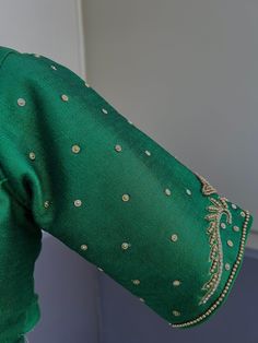 Green Color Raw Silk Readymade Blouse with beautiful Handwork Work in beads and Zircon. Item : Readymade BlouseReady-to-Wear : YesSize : 36 (Can be opened to Size 40)Color : Bottle Green Blouse Fabric : Raw Silk Lining : Yes, it is fully lined Padded or Non-Padded : PaddedClosure: Front Closure with hooks.Disclaimer - : -This is a Standard Size blouse. We do not guarantee perfect fit as every body and shape is different. Little or no alteration would be required to get the perfect fit. - Color v Festive Long Sleeve Blouse With Pearl Embroidery, Bollywood Festive Blouse With Pearl Embroidery, Festive Bollywood Blouse With Pearl Embroidery, Traditional Long Sleeve Blouse With Pearl Embroidery, Bollywood Style Festive Tops With Pearl Embroidery, Green Long Sleeve Top For Wedding, Elegant Tops With Dori Work For Festive Season, Fitted Green Blouse With Handwork, Elegant Handwork Blouse For Festive Occasions