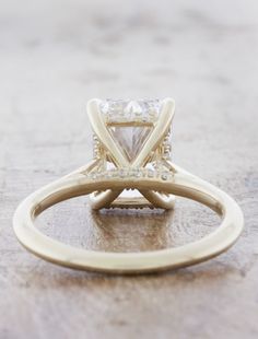 an engagement ring with a princess cut diamond