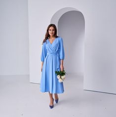 This A-Line Wrap Midi Dress is your go-to for casual and formal events, making you feel confident and stylish wherever you go. With its stunning light blue color, this midi dress is perfect for any season - summer, spring, or autumn. The wrap style and A-line silhouette create a flattering look that accentuates your natural waistline. The back zipper adds a touch of convenience while maintaining a sleek appearance. The 3/4 sleeves and V-neckline give this dress a sophisticated yet playful vibe. The plain pattern in silk fabric adds a touch of elegance to your overall look, while the fabric's natural shine catches everyone's attention. This versatile dress is suitable for various occasions - from cocktail parties to birthday celebrations or even as a guest at weddings. It's also ideal for g Light Blue Elegant Evening Dress, Chic Light Blue Dress For Fall, Elegant Light Blue Evening Dress, Light Blue Bridesmaid Dress For Spring, Spring Bridesmaid Dress In Light Blue, Spring Light Blue Bridesmaid Dress, Light Blue Dresses For Spring Wedding Guests, Elegant Light Blue Fall Dress, Spring Light Blue Dresses For Wedding Guests